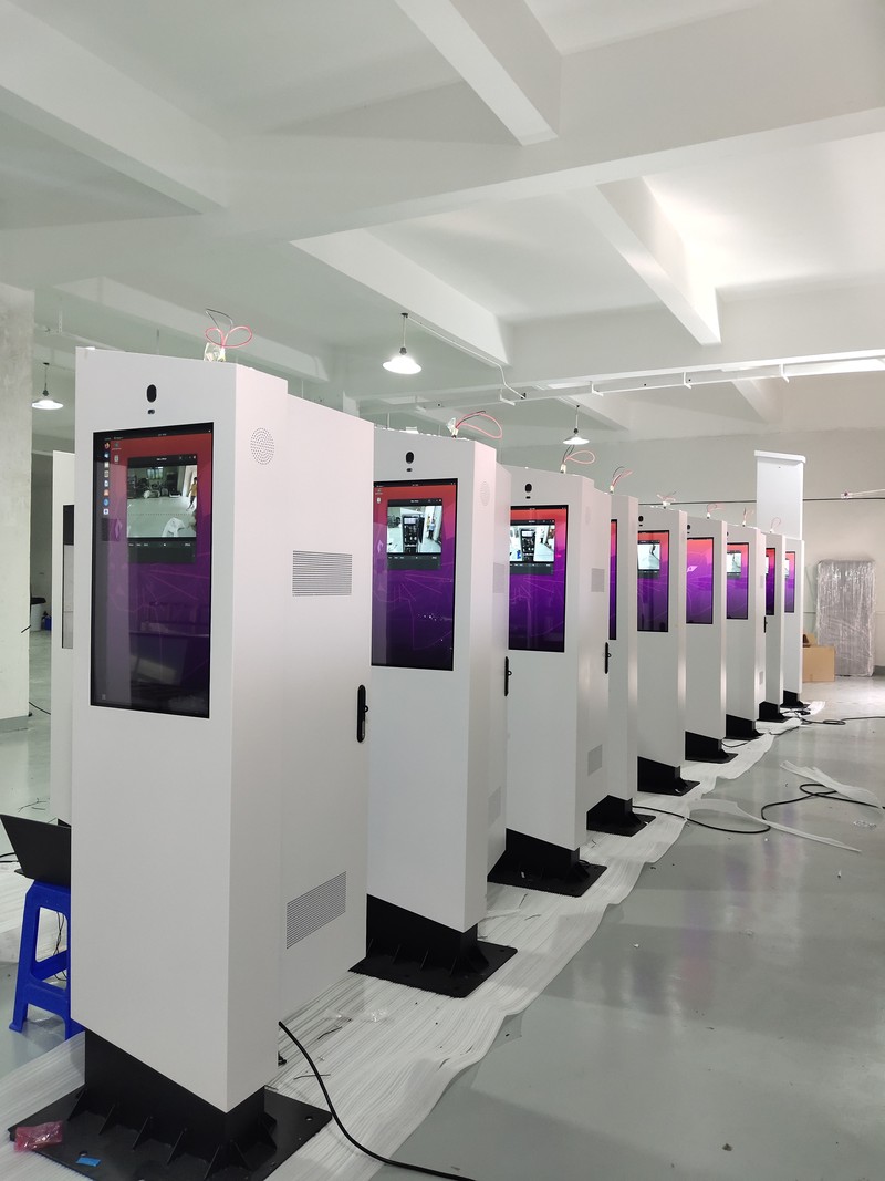Floor-standing outdoor advertising displays undergoing batch screen testing