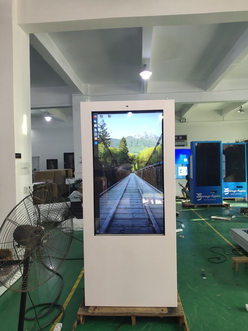 two white outdoor displays inspected before shipment to the Netherlands