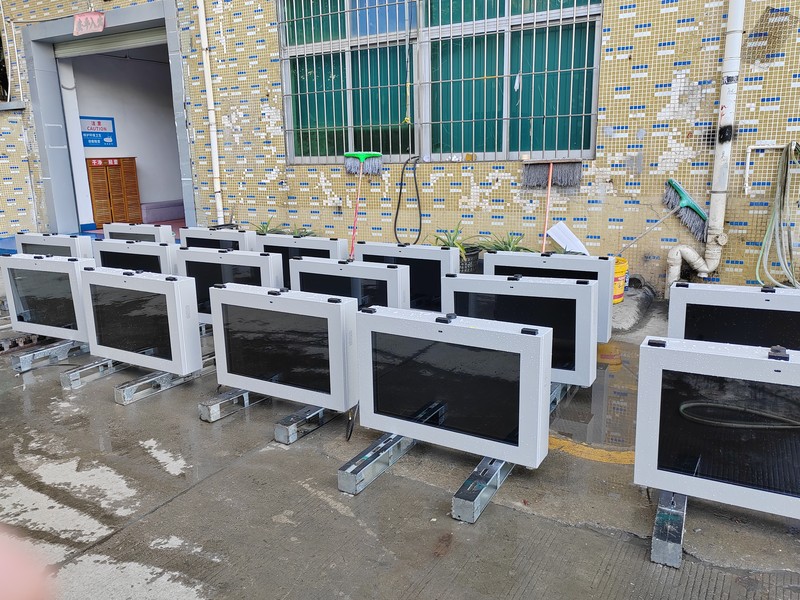 32-inch horizontal LCD displays during cabinet assembly